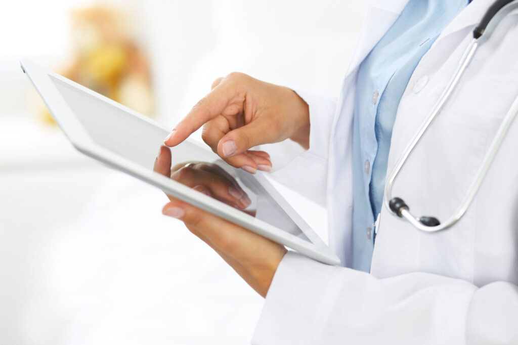 Medical Provider using RHIO software on Tablet